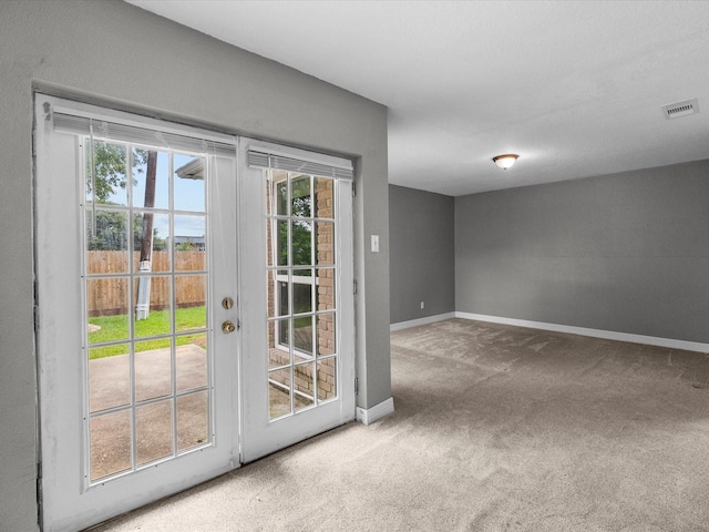 11731 Flushing Meadows Dr, Houston, TX 77089 - doorway featuring carpet flooring, baseboards, healthy amount of natural light, and french doors