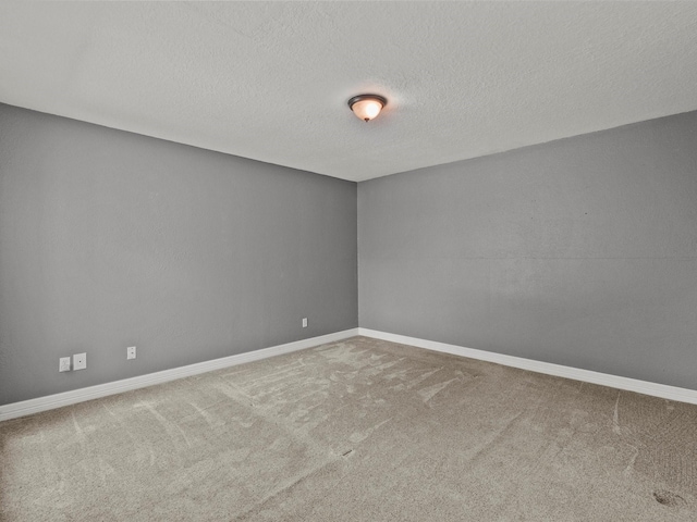 11731 Flushing Meadows Dr, Houston, TX 77089 - carpeted empty room with baseboards and a textured ceiling