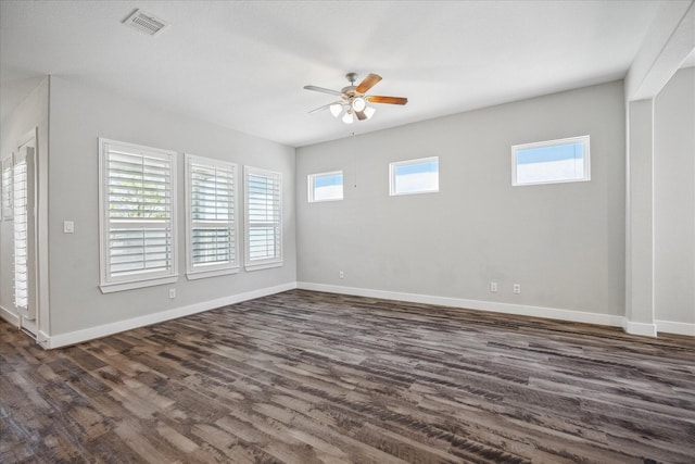 10022 Waving Grain Ln, Houston, TX 77080 - spare room featuring a ceiling fan, baseboards, and dark wood finished floors