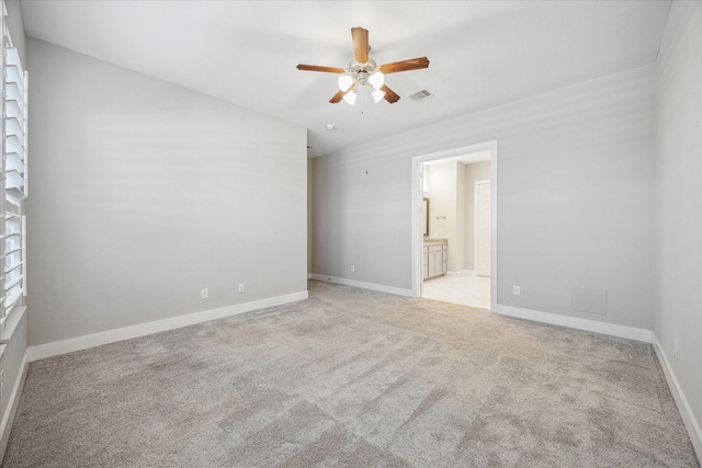 10022 Waving Grain Ln, Houston, TX 77080 - spare room featuring ceiling fan, light carpet, and baseboards