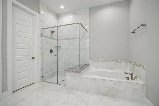 10022 Waving Grain Ln, Houston, TX 77080 - bathroom featuring a bath, a shower stall, and marble finish floors