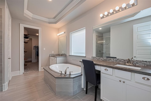16826 Ellicott Rock Dr, Humble, TX 77346 - full bath featuring a stall shower, a bath, a walk in closet, and two vanities