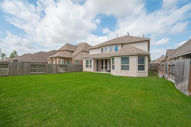 16826 Ellicott Rock Dr, Humble, TX 77346 - back of property featuring brick siding and a patio area