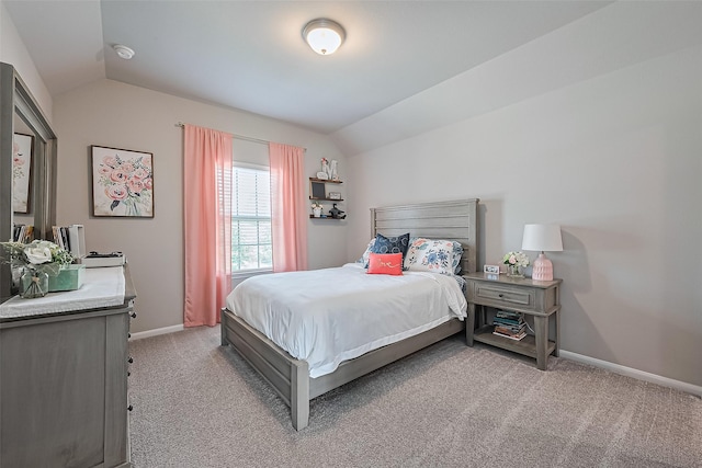 16826 Ellicott Rock Dr, Humble, TX 77346 - bedroom with vaulted ceiling, light carpet, and baseboards