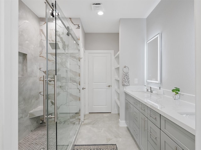 825 Paul Quinn St Unit E, Houston, TX 77091 - bathroom featuring a marble finish shower, double vanity, and marble finish floors