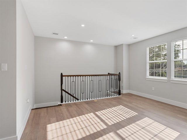 825 Paul Quinn St Unit E, Houston, TX 77091 - empty room featuring wood finished floors, baseboards, and recessed lighting