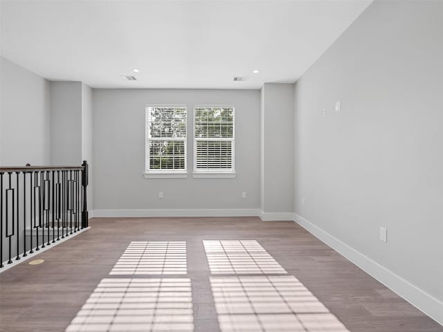 825 Paul Quinn St Unit E, Houston, TX 77091 - spare room featuring wood finished floors, baseboards, and recessed lighting