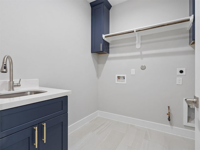 825 Paul Quinn St Unit E, Houston, TX 77091 - washroom with gas dryer hookup, electric dryer hookup, washer hookup, cabinet space, and baseboards