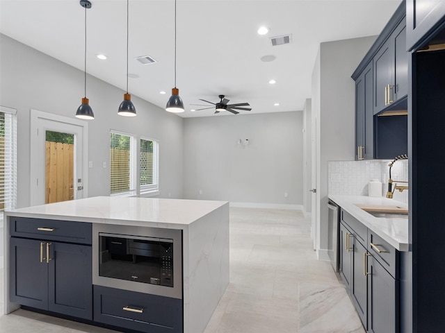 825 Paul Quinn St Unit E, Houston, TX 77091 - kitchen with built in microwave, a sink, backsplash, recessed lighting, and stainless steel dishwasher