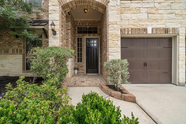 27303 Balson Forest Ln, Spring, TX 77386 - view of exterior entry featuring concrete driveway, stone siding, and brick siding
