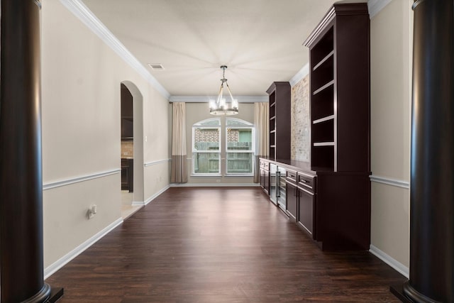 27303 Balson Forest Ln, Spring, TX 77386 - unfurnished dining area with a chandelier, crown molding, arched walkways, dark wood finished floors, and baseboards