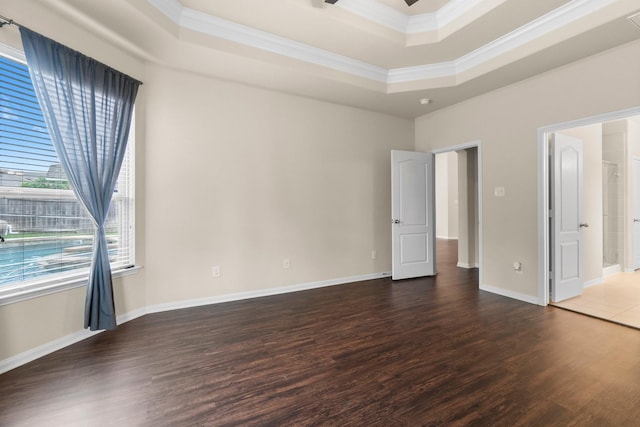 27303 Balson Forest Ln, Spring, TX 77386 - unfurnished bedroom with a tray ceiling, wood finished floors, ornamental molding, and baseboards
