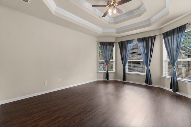 27303 Balson Forest Ln, Spring, TX 77386 - unfurnished room with crown molding, healthy amount of natural light, a raised ceiling, dark wood finished floors, and ceiling fan