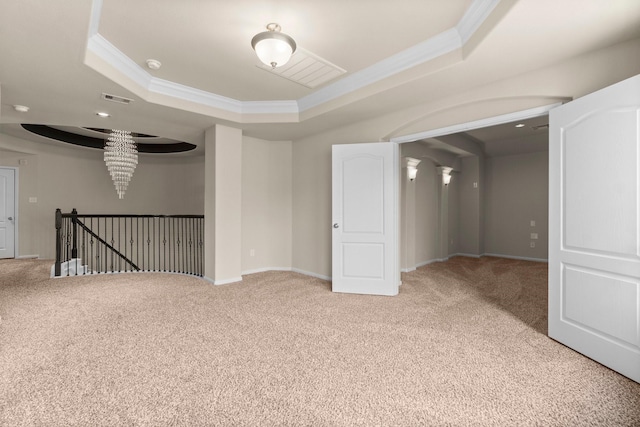 27303 Balson Forest Ln, Spring, TX 77386 - spare room with a raised ceiling, carpet flooring, ornamental molding, and a chandelier