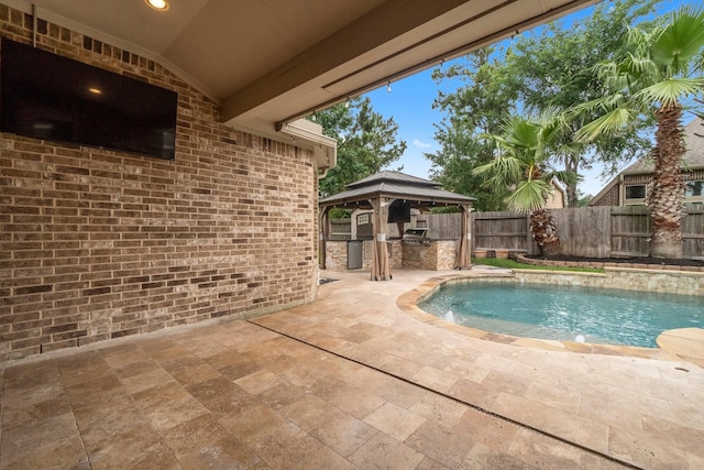 27303 Balson Forest Ln, Spring, TX 77386 - view of pool with a gazebo, a patio, a fenced backyard, and exterior kitchen