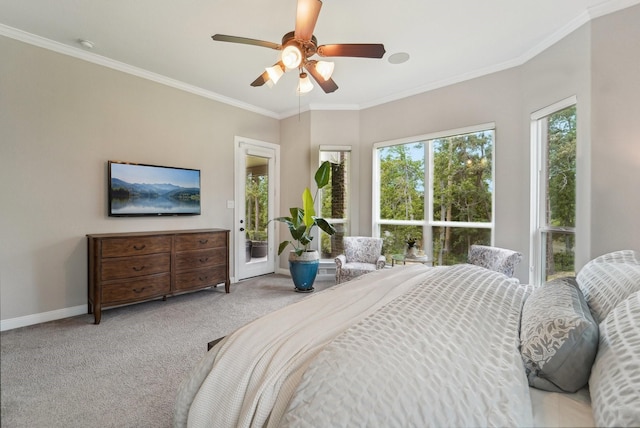 13710 Nubenbrook Lake Dr, Houston, TX 77044 - carpeted bedroom with access to exterior, baseboards, ornamental molding, and ceiling fan