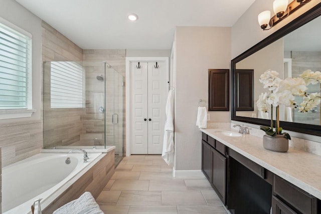 13710 Nubenbrook Lake Dr, Houston, TX 77044 - full bathroom with healthy amount of natural light, a shower stall, a bath, and vanity