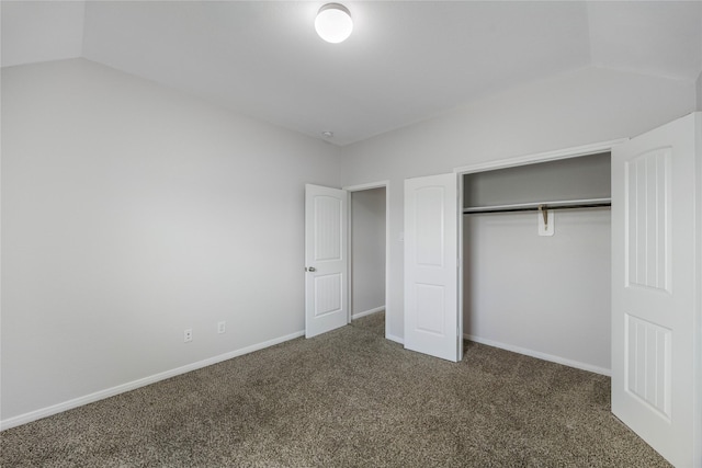 11915 Eagle Ridge Dr, Mont Belvieu, TX 77535 - unfurnished bedroom with carpet flooring, a closet, vaulted ceiling, and baseboards