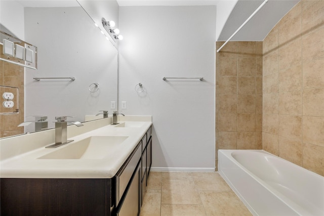 11915 Eagle Ridge Dr, Mont Belvieu, TX 77535 - bathroom with baseboards, double vanity, tile patterned flooring, and bathing tub / shower combination
