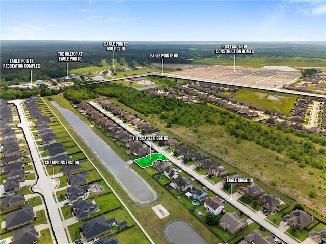11915 Eagle Ridge Dr, Mont Belvieu, TX 77535 - aerial overview of property's location with nearby suburban area and a large body of water