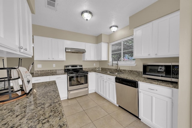 4803 Bridgemont Ln, Spring, TX 77388 - kitchen featuring appliances with stainless steel finishes, a sink, white cabinetry, and stone countertops