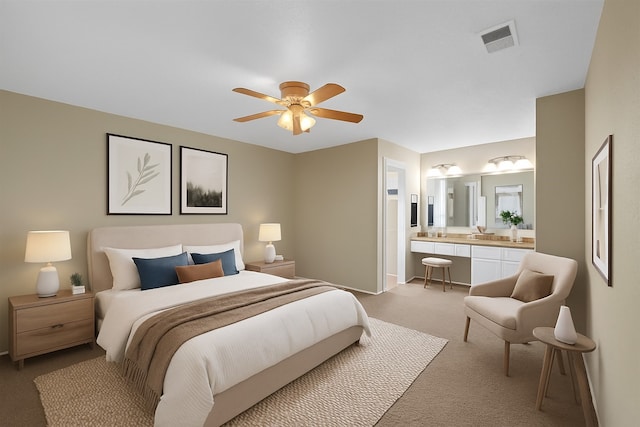 4803 Bridgemont Ln, Spring, TX 77388 - bedroom with light colored carpet, ensuite bathroom, baseboards, and a ceiling fan