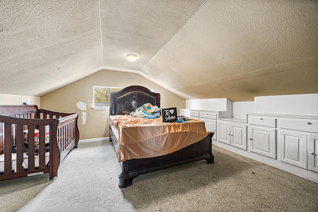 12910 Green River Dr, Houston, TX 77044 - carpeted bedroom with a textured ceiling, lofted ceiling, and baseboards