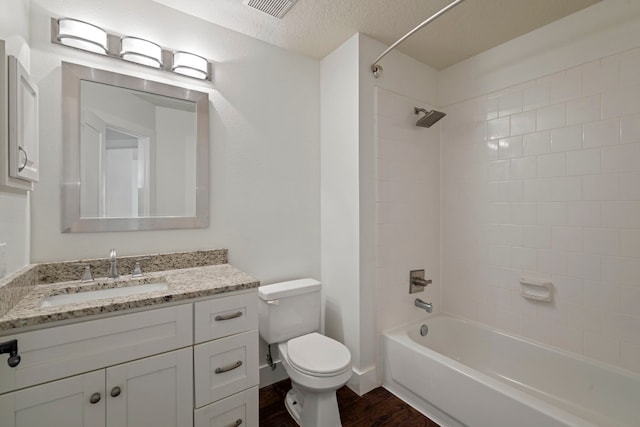 20711 Medallion Pointe Dr, Katy, TX 77450 - full bathroom with wood finished floors, toilet, bathtub / shower combination, vanity, and a textured ceiling