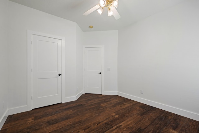 20711 Medallion Pointe Dr, Katy, TX 77450 - unfurnished bedroom with dark wood finished floors, baseboards, and ceiling fan