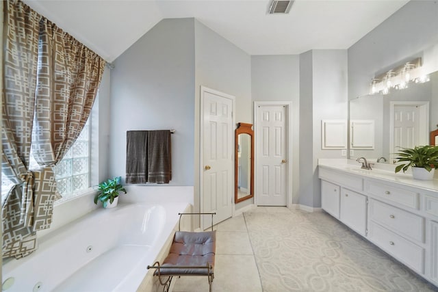 7410 Fall Creek Bnd, Humble, TX 77396 - full bathroom with a whirlpool tub, vanity, lofted ceiling, tile patterned flooring, and baseboards