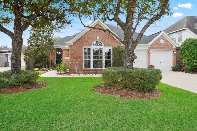 7410 Fall Creek Bnd, Humble, TX 77396 - view of front of house featuring brick siding, concrete driveway, a front lawn, and roof with shingles