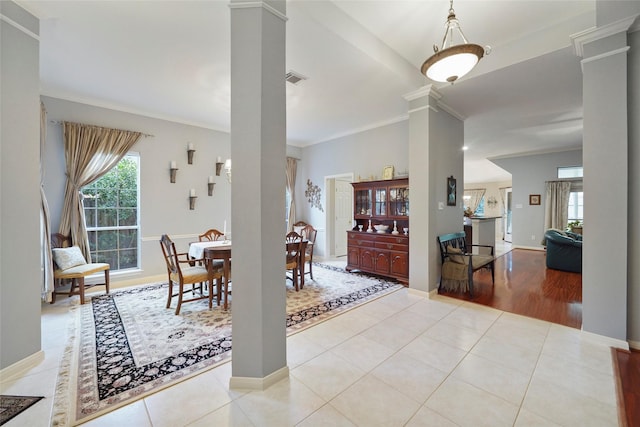 7410 Fall Creek Bnd, Humble, TX 77396 - tiled dining area with decorative columns, ornamental molding, and baseboards