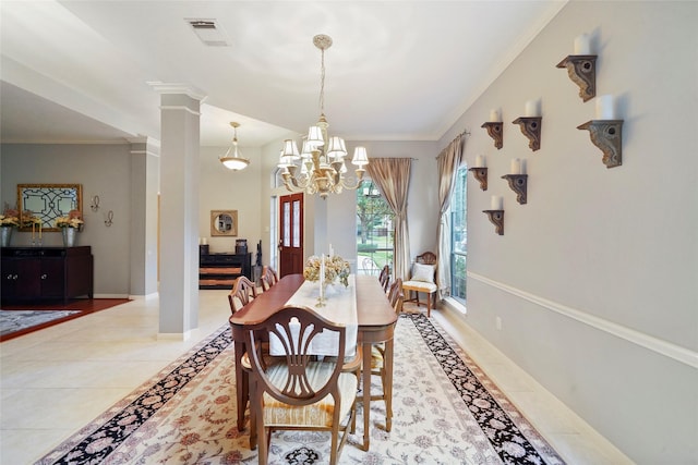 7410 Fall Creek Bnd, Humble, TX 77396 - dining space with light tile patterned flooring, a chandelier, crown molding, decorative columns, and baseboards