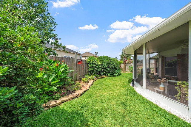 7410 Fall Creek Bnd, Humble, TX 77396 - view of yard featuring a sunroom