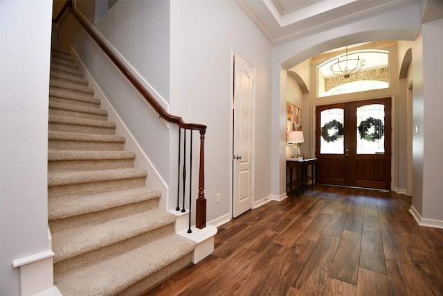 21006 Refuge Creek Dr, Cypress, TX 77433 - foyer with arched walkways, stairs, dark wood finished floors, crown molding, and baseboards