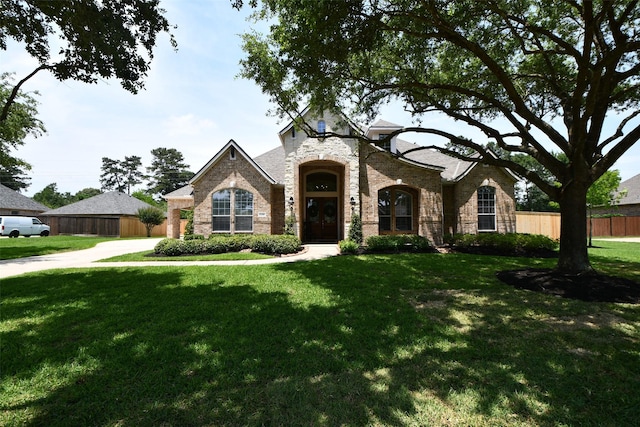 21006 Refuge Creek Dr, Cypress, TX 77433 - french country style house with brick siding and stone siding