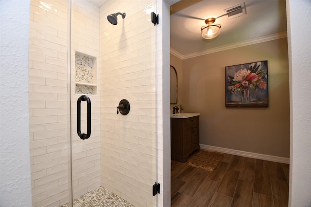 21006 Refuge Creek Dr, Cypress, TX 77433 - full bath with crown molding, a stall shower, wood finish floors, baseboards, and vanity