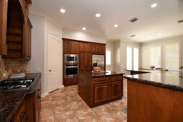 21006 Refuge Creek Dr, Cypress, TX 77433 - kitchen featuring stainless steel appliances, a kitchen island, backsplash, recessed lighting, and ornamental molding