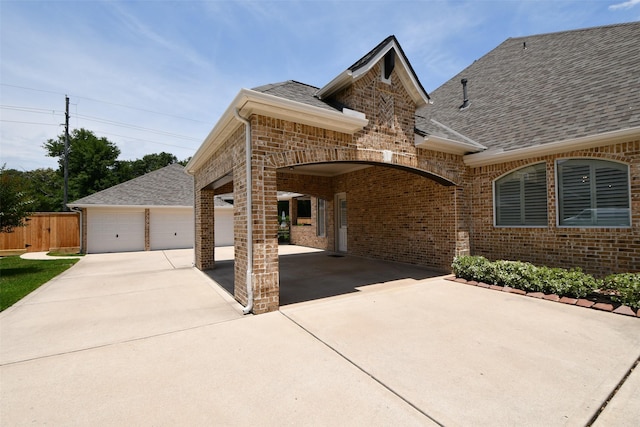 21006 Refuge Creek Dr, Cypress, TX 77433 - view of front of property featuring brick siding, a shingled roof, and a garage