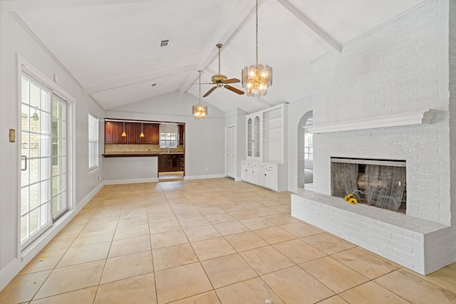 6003 Green Falls Dr, Houston, TX 77088 - unfurnished living room featuring light tile patterned floors, a chandelier, beamed ceiling, a fireplace, and plenty of natural light