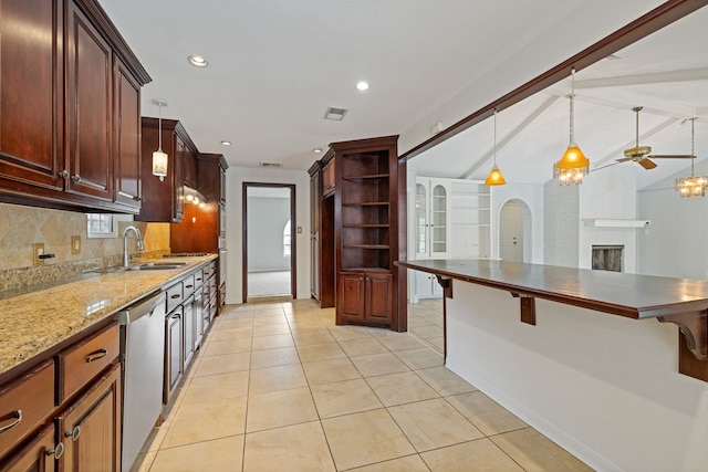 6003 Green Falls Dr, Houston, TX 77088 - kitchen featuring dishwasher, tasteful backsplash, a kitchen bar, open shelves, and pendant lighting