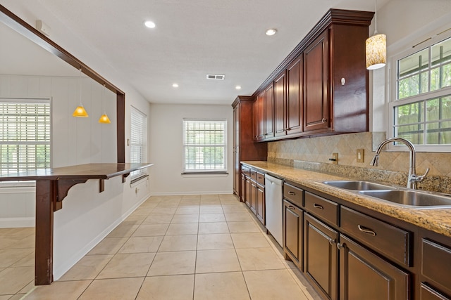 6003 Green Falls Dr, Houston, TX 77088 - kitchen featuring a sink, dishwasher, backsplash, baseboards, and recessed lighting