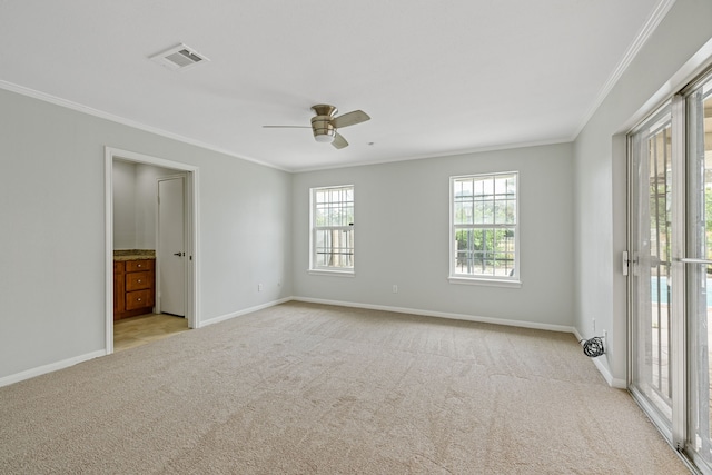 6003 Green Falls Dr, Houston, TX 77088 - carpeted spare room with crown molding, baseboards, and ceiling fan