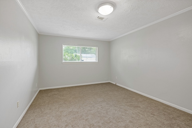 6003 Green Falls Dr, Houston, TX 77088 - spare room featuring a textured ceiling, crown molding, carpet, and baseboards