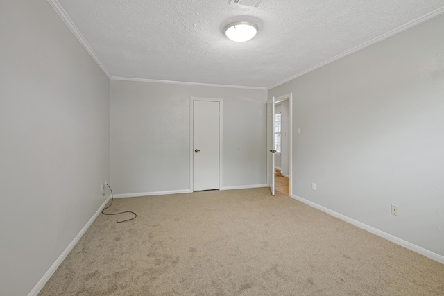 6003 Green Falls Dr, Houston, TX 77088 - carpeted empty room with a textured ceiling, baseboards, and ornamental molding