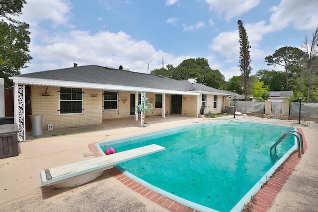 6003 Green Falls Dr, Houston, TX 77088 - view of pool featuring a diving board, a patio area, and central air condition unit