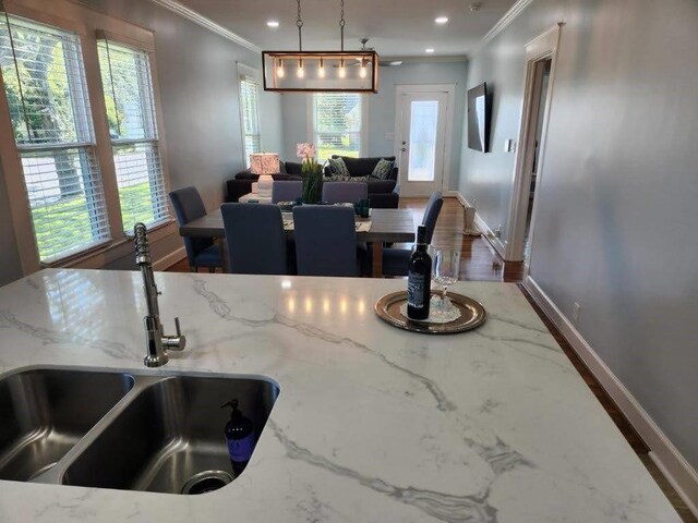 4702 Avenue N 1/2 Avenue, Galveston, TX 77551 - dining space featuring ornamental molding, baseboards, recessed lighting, and wood finished floors