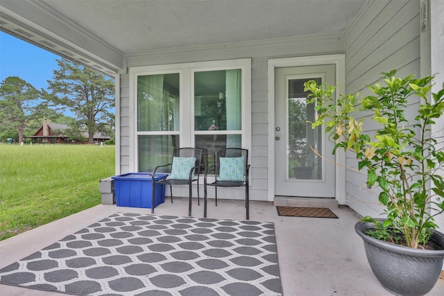 12 Oakland Ct, Huntsville, TX 77340 - property entrance featuring a patio area and a yard