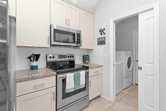 12 Oakland Ct, Huntsville, TX 77340 - kitchen with appliances with stainless steel finishes, tasteful backsplash, light tile patterned floors, white cabinets, and light stone counters