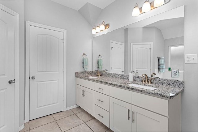12 Oakland Ct, Huntsville, TX 77340 - bathroom featuring double vanity, tile patterned flooring, and baseboards